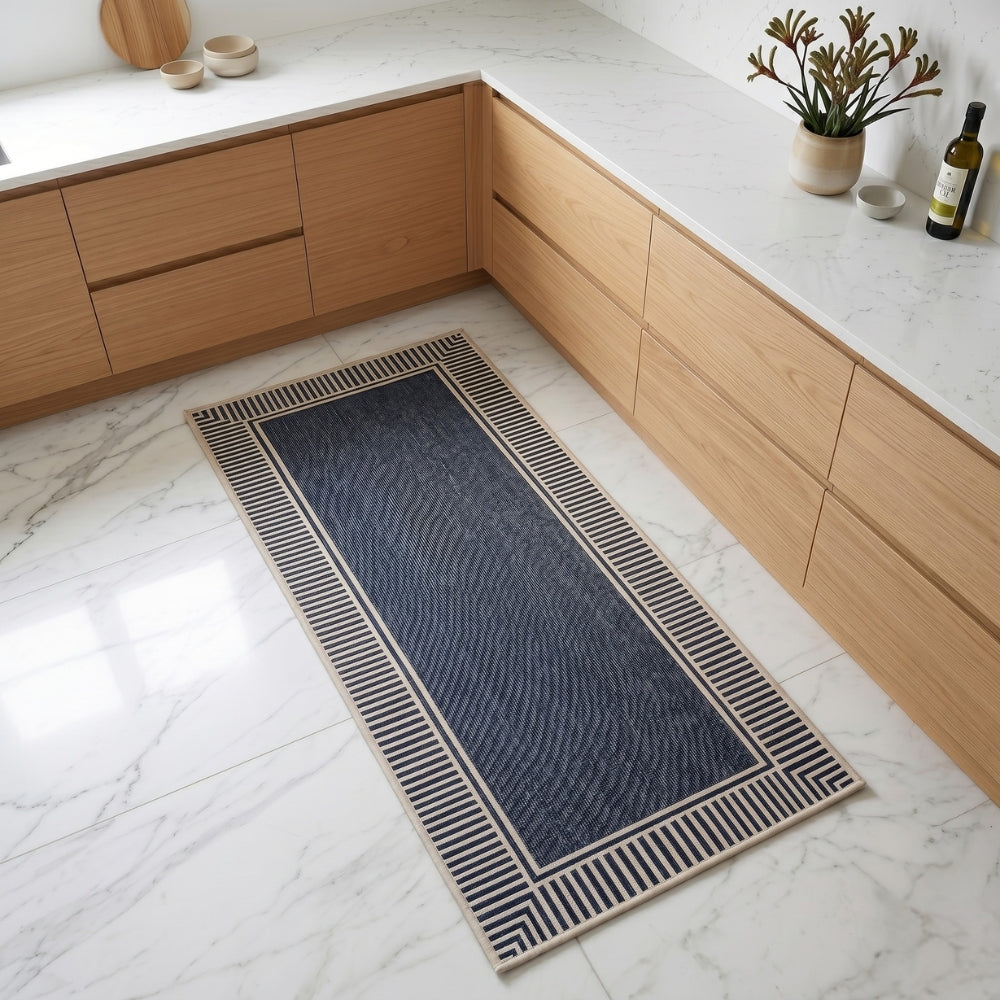 Blue runner rug on a marble floor in a kitchen setting