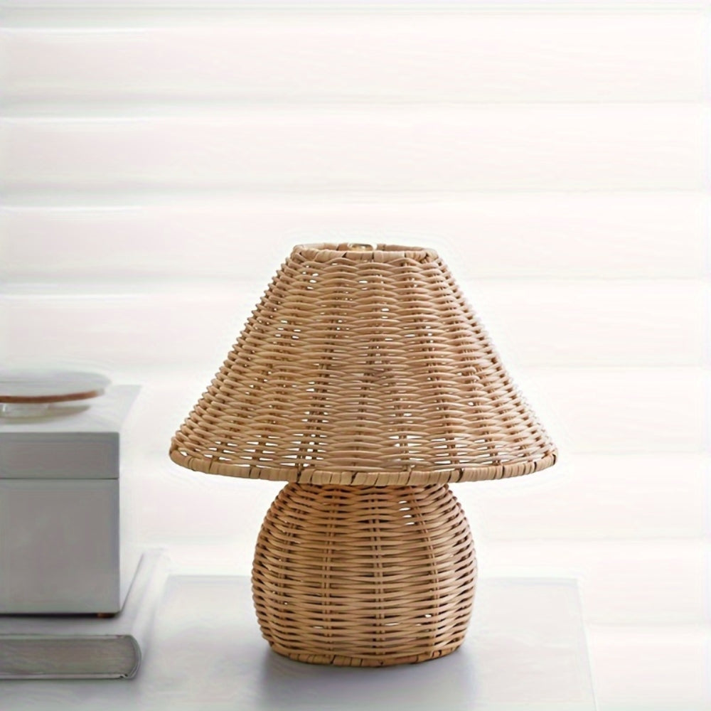 Wicker table lamp on a white surface with a neutral background