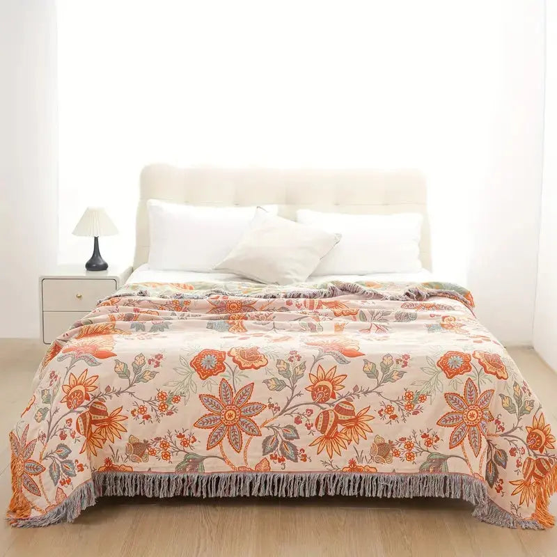 Floral patterned comforter on a bed in a bedroom setting