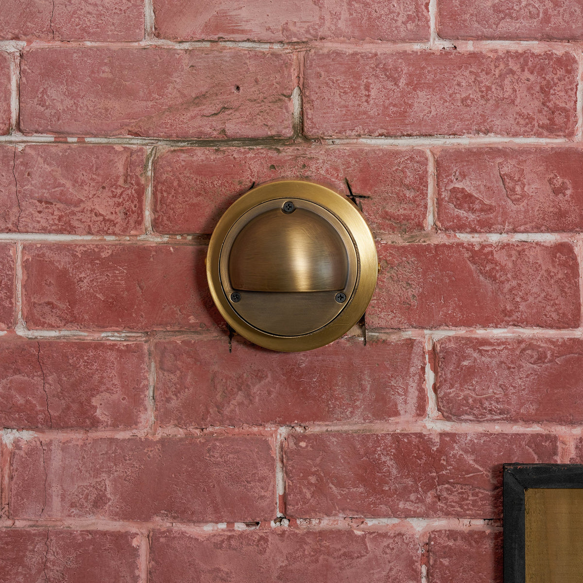 Round Brass Wall Sconce with Shielded Glow