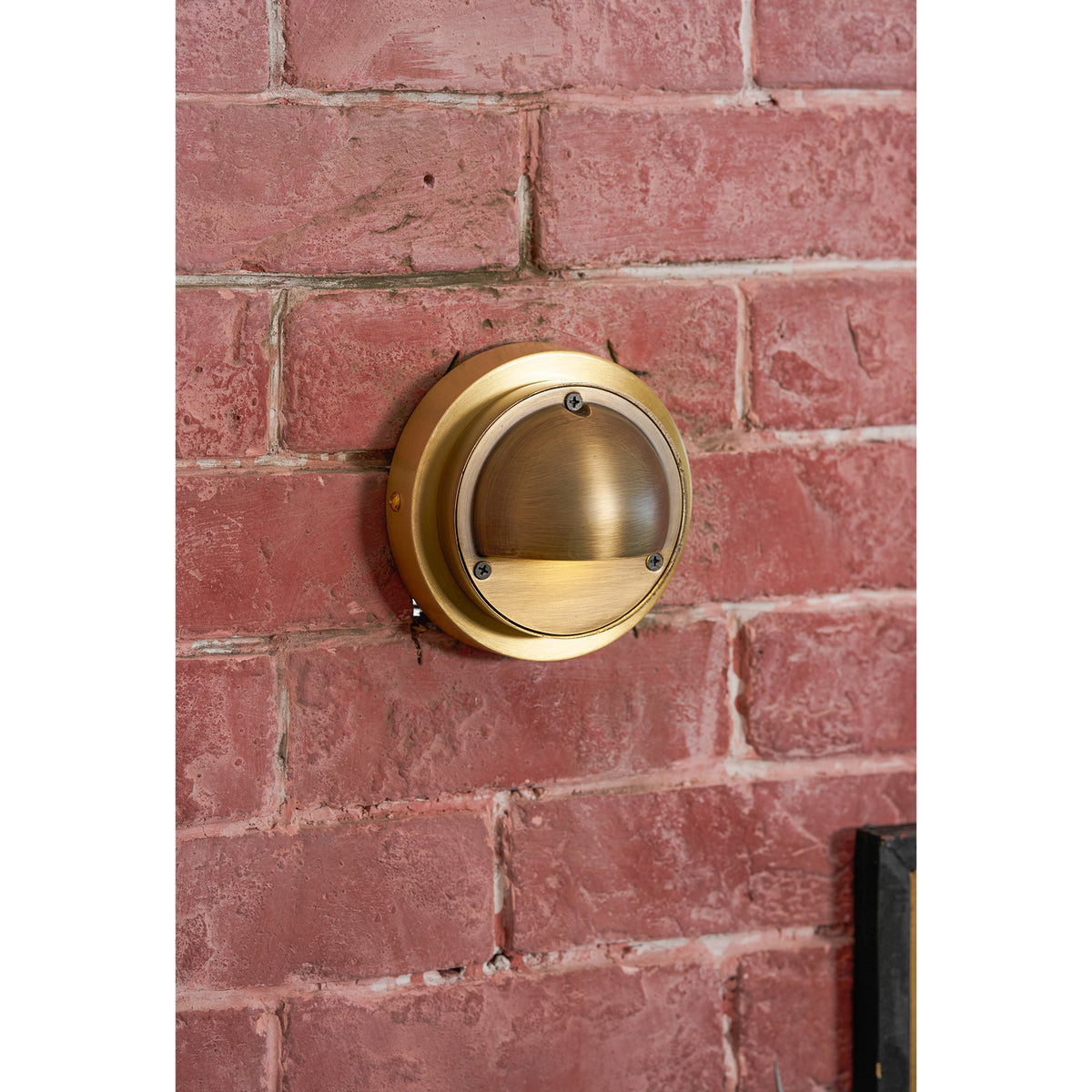 Round Brass Wall Sconce with Shielded Glow