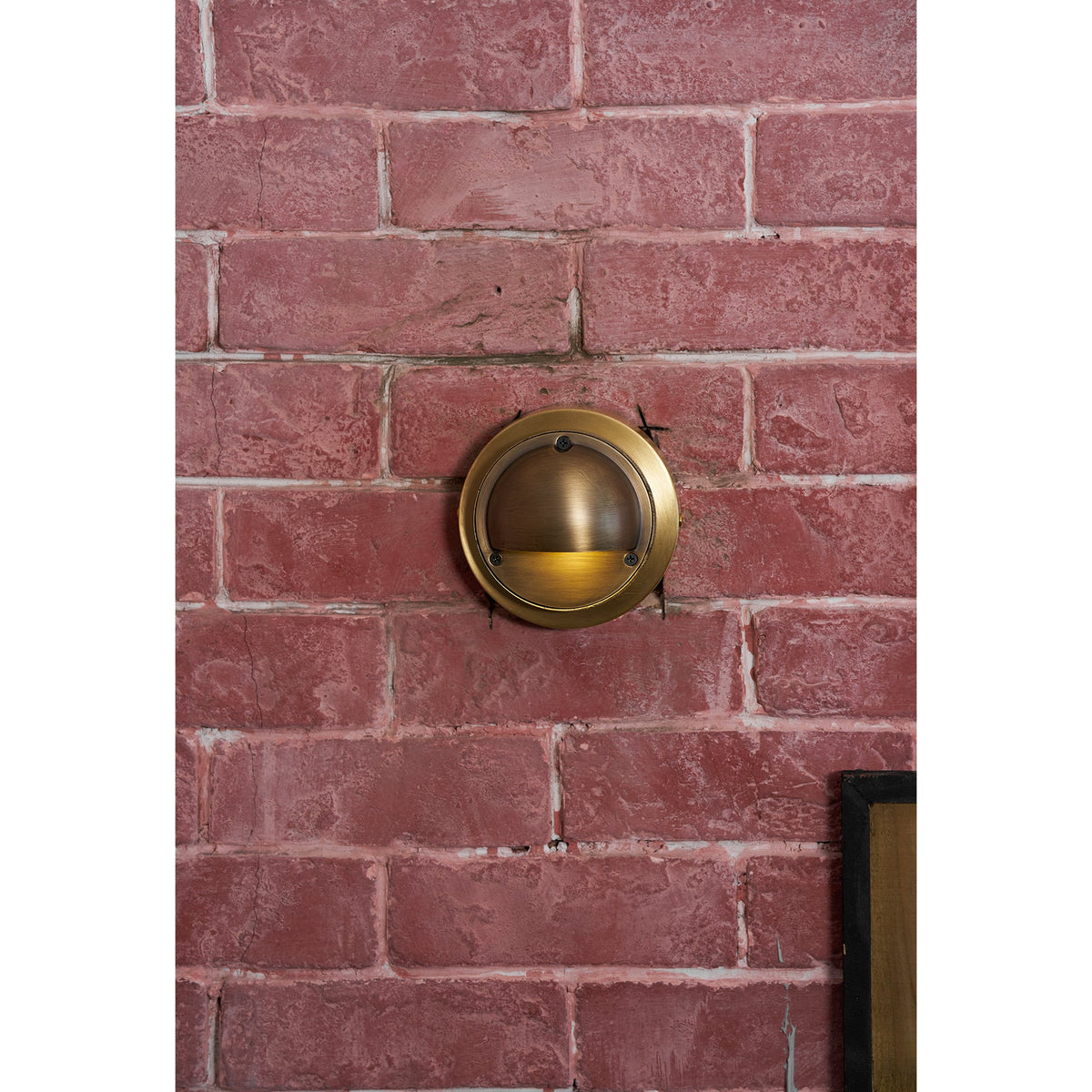 Round Brass Wall Sconce with Shielded Glow