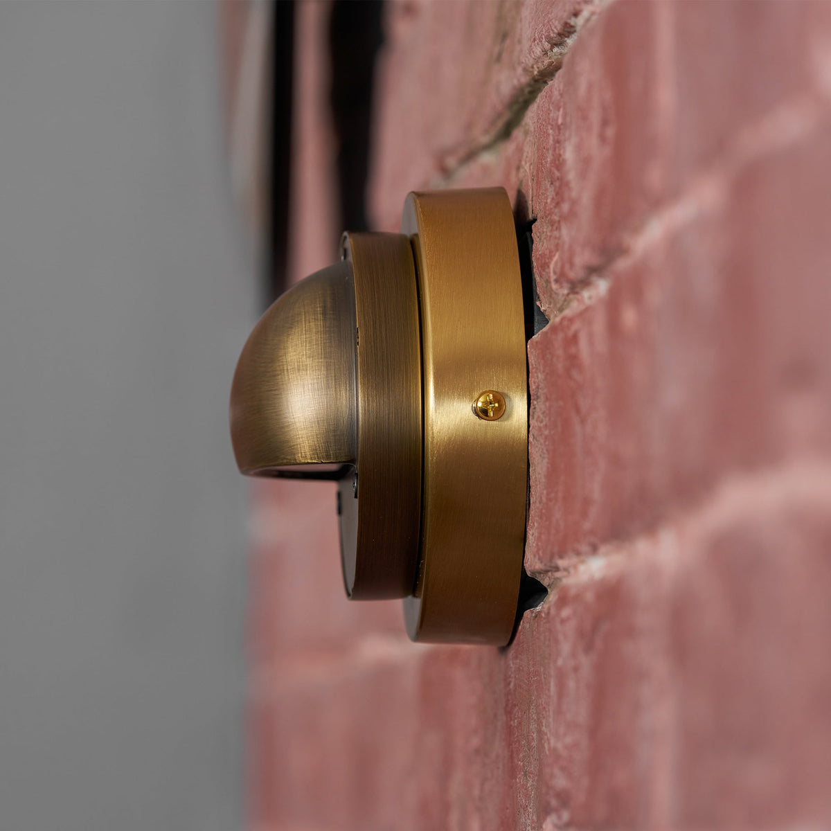 Round Brass Wall Sconce with Shielded Glow