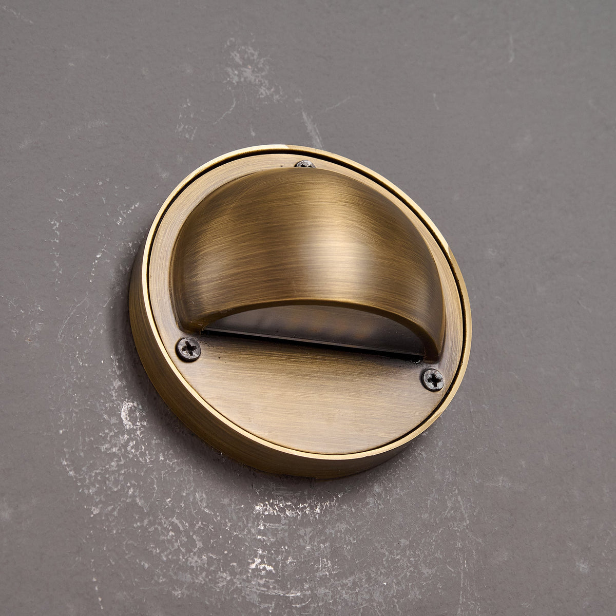 Round Brass Wall Sconce with Shielded Glow