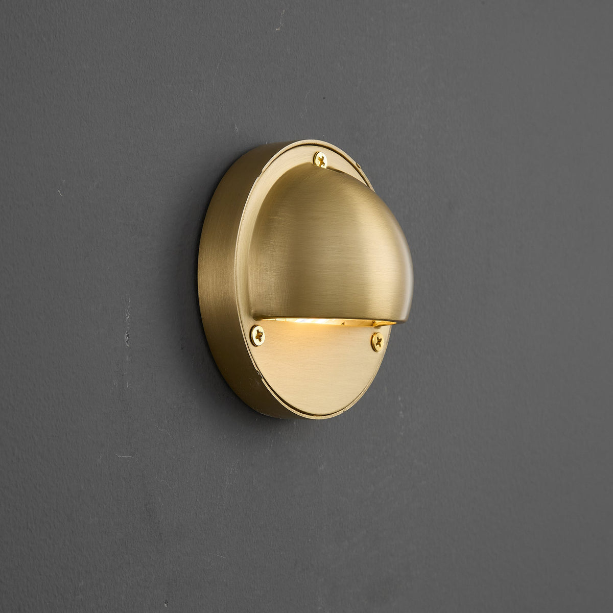 Round Brass Wall Sconce with Shielded Glow