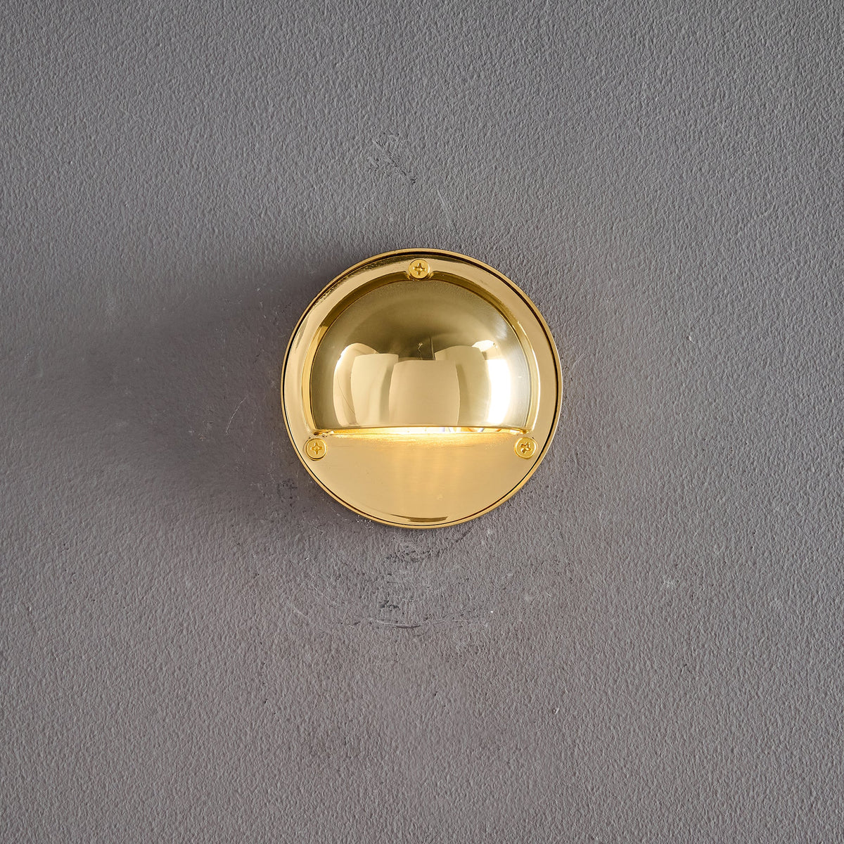 Round Brass Wall Sconce with Shielded Glow