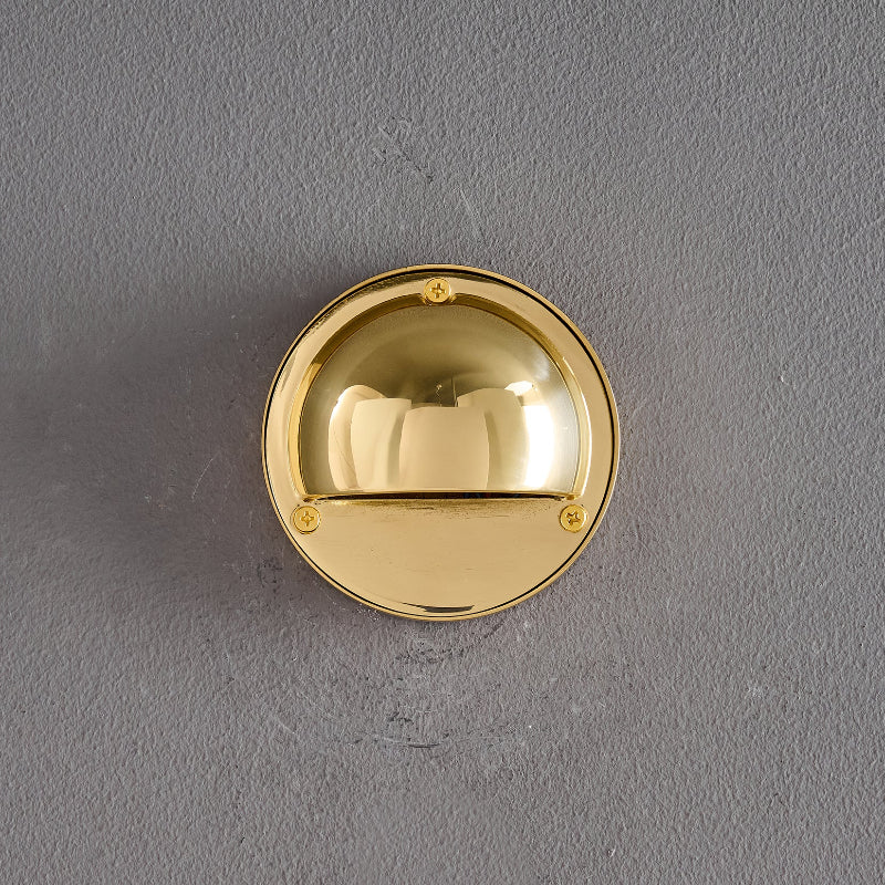 Round Brass Wall Sconce with Shielded Glow