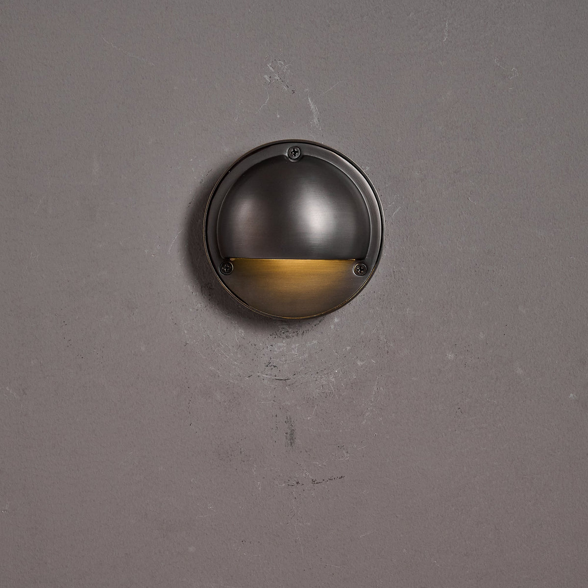 Round Brass Wall Sconce with Shielded Glow
