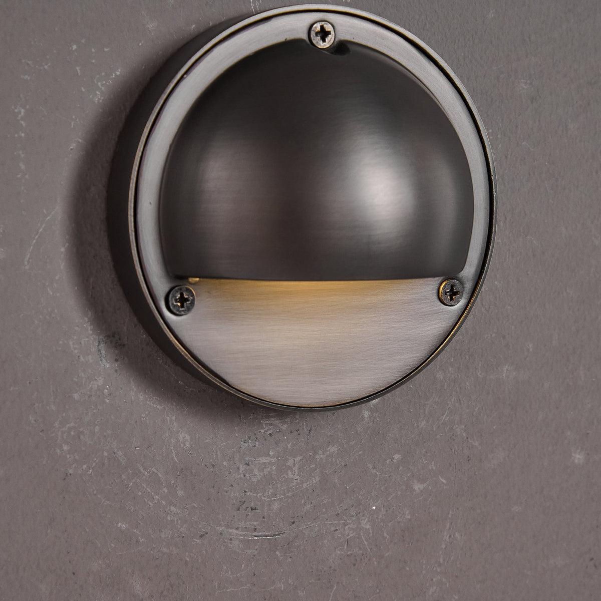 Round Brass Wall Sconce with Shielded Glow