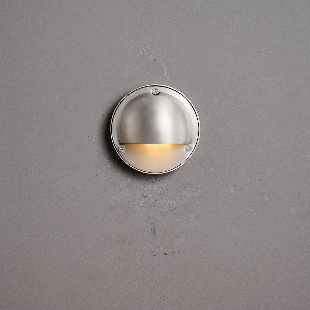 Round Brass Wall Sconce with Shielded Glow