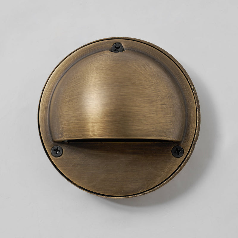 Round Brass Wall Sconce with Shielded Glow