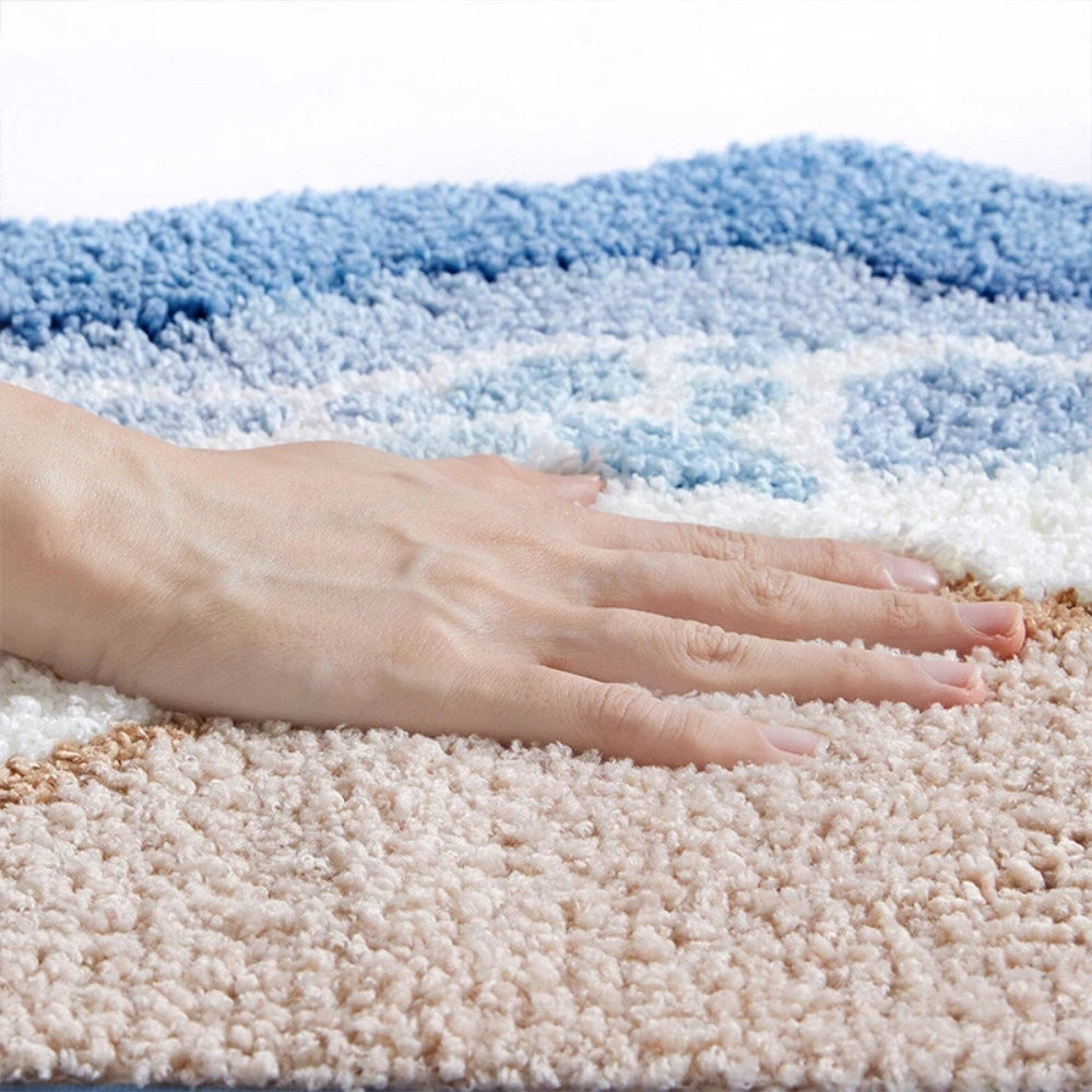 Hand on a textured blue and beige carpet