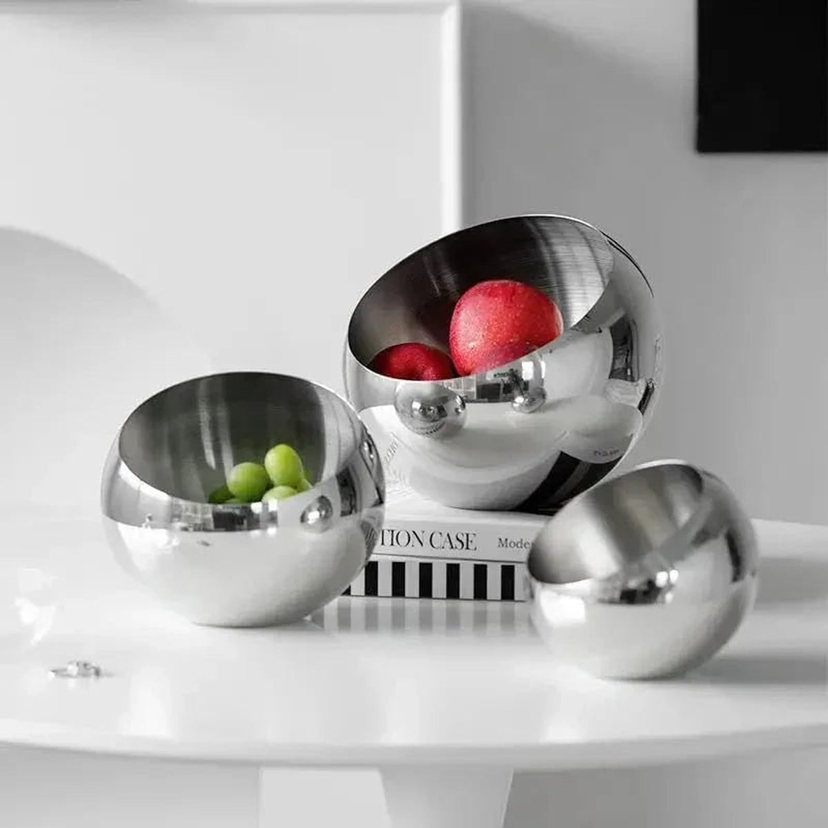 Polished Stainless Steel Fruit Bowl With Modern Open Design - Image 3
