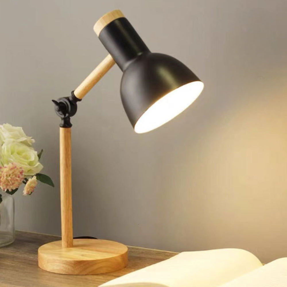Black and wooden desk lamp on a neutral background