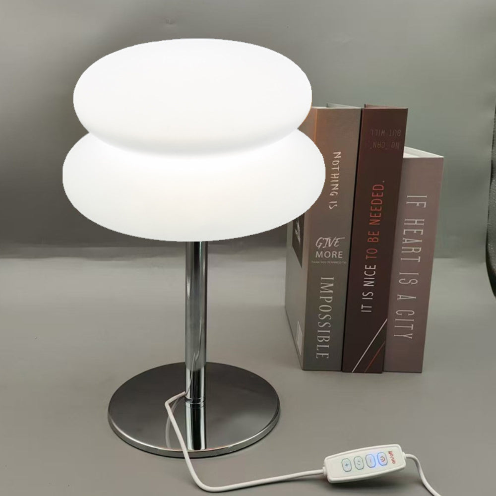 Modern table lamp with a control panel on a gray surface