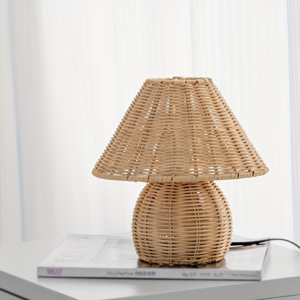 Wicker table lamp on a surface with a white background