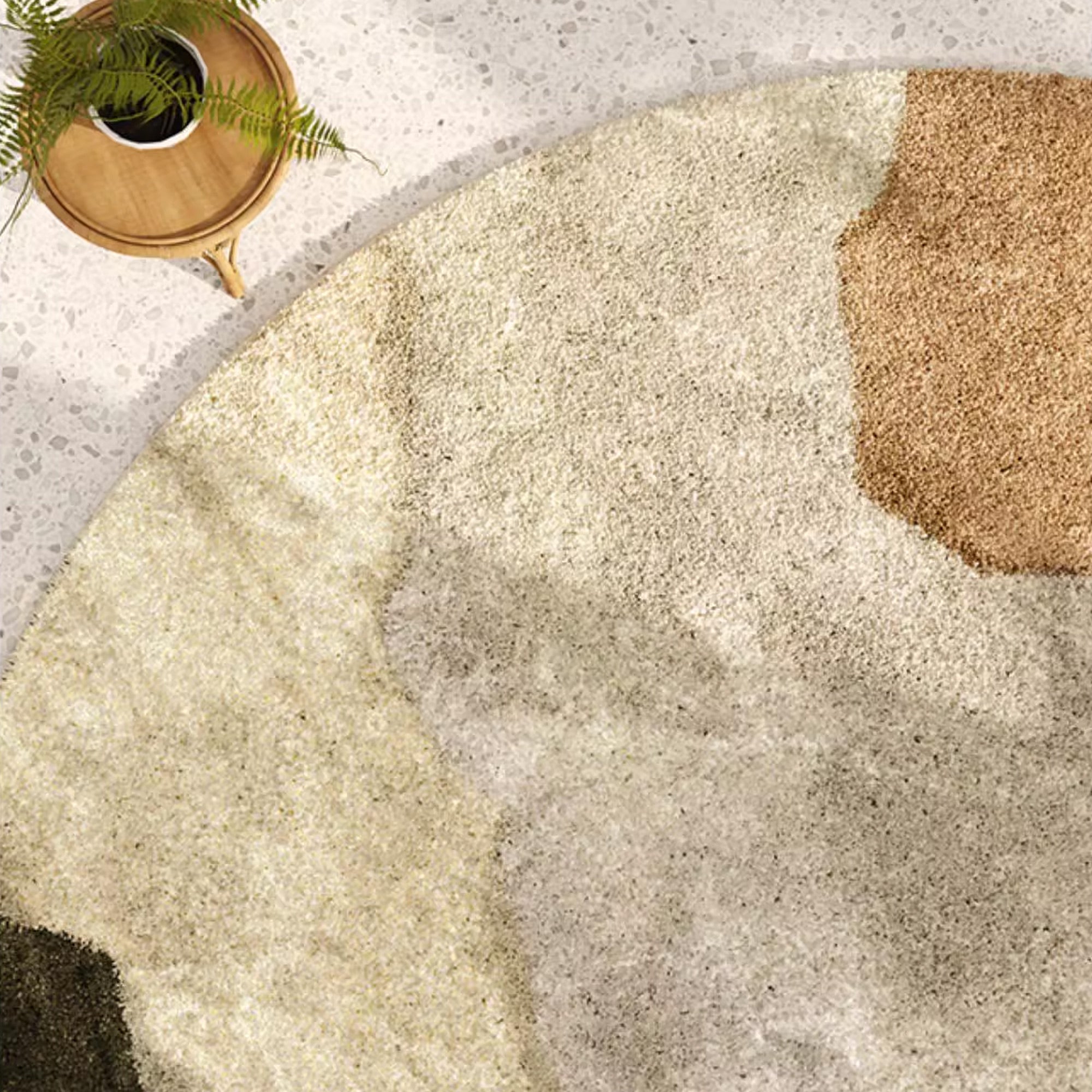 Earth Tone Round Area Rug with Abstract Art