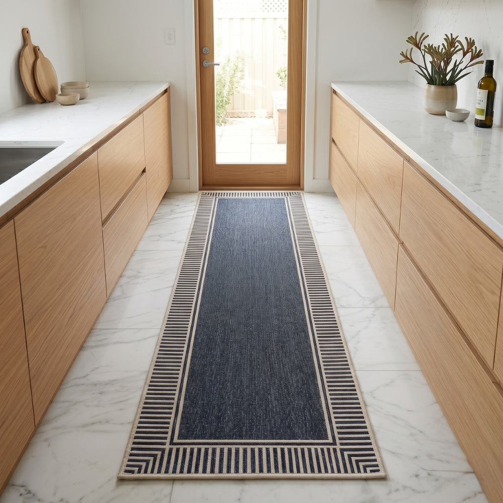 Kitchen with a blue patterned rug on the floor