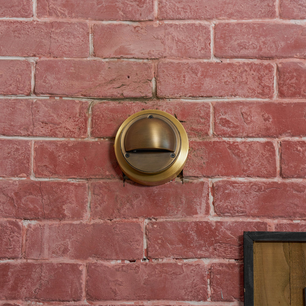 Round Brass Wall Sconce with Shielded Glow