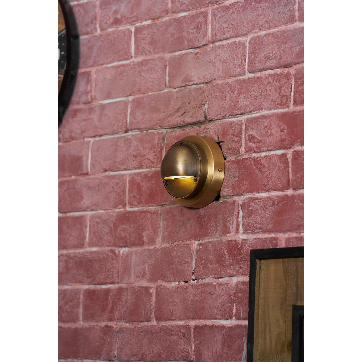 Round Brass Wall Sconce with Shielded Glow