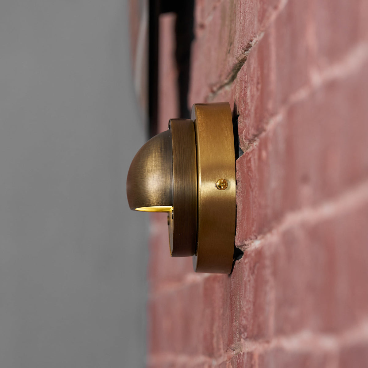 Round Brass Wall Sconce with Shielded Glow