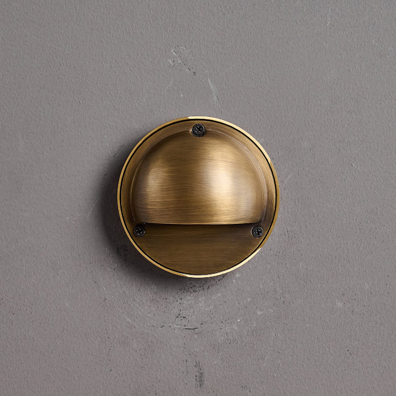 Round Brass Wall Sconce with Shielded Glow