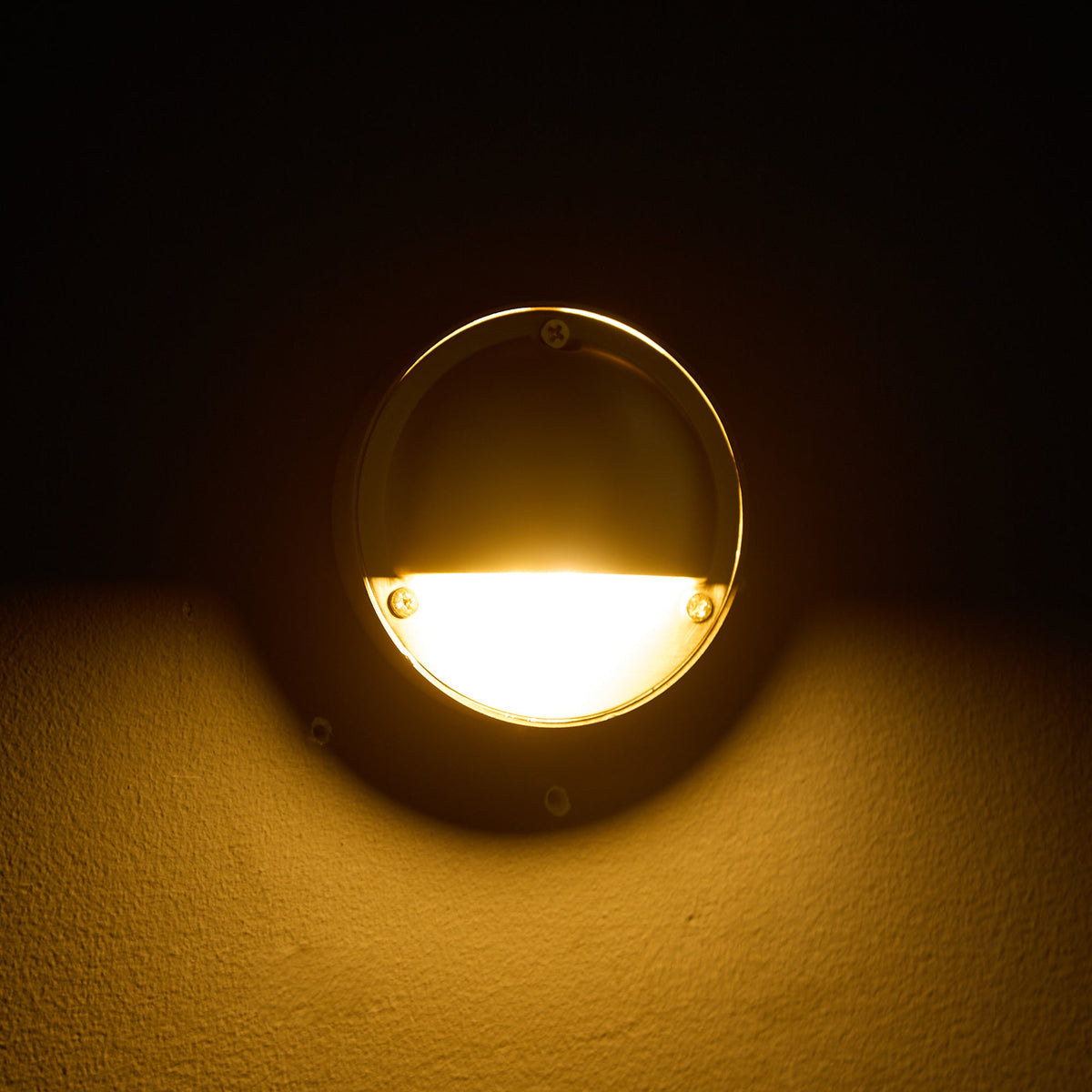 Round Brass Wall Sconce with Shielded Glow