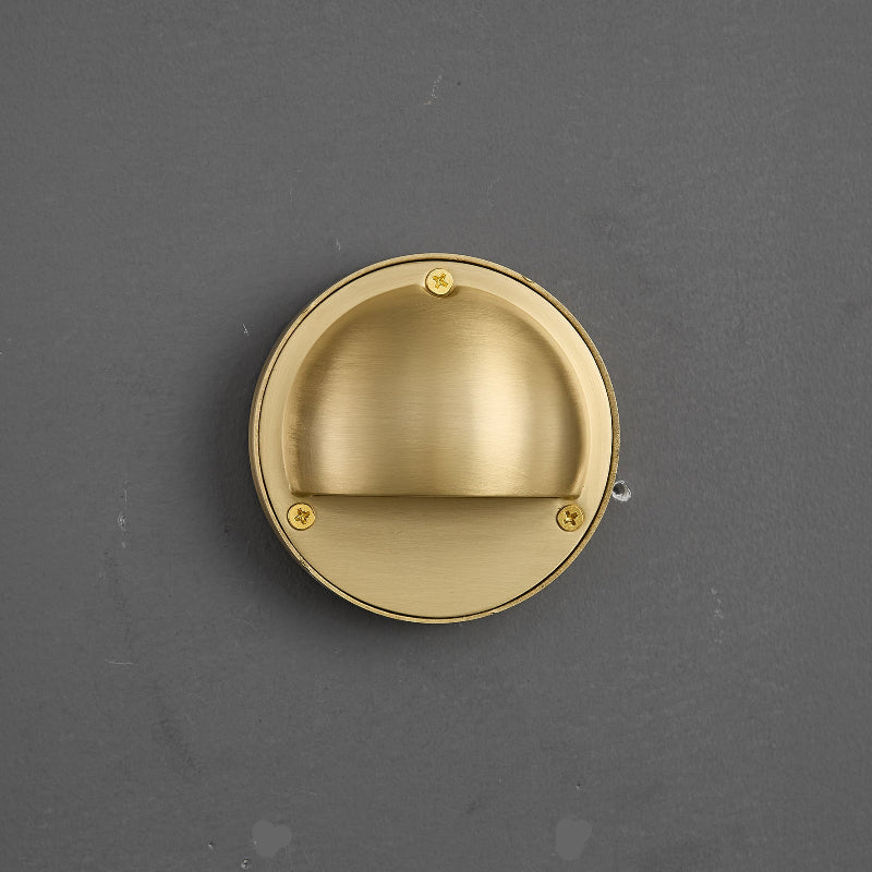 Round Brass Wall Sconce with Shielded Glow