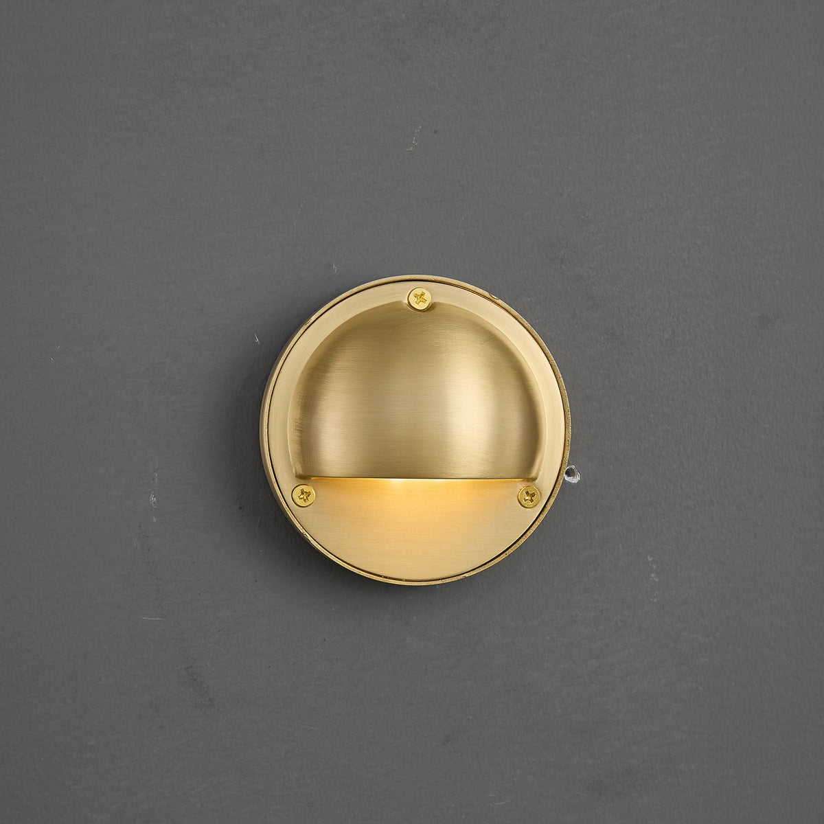 Round Brass Wall Sconce with Shielded Glow