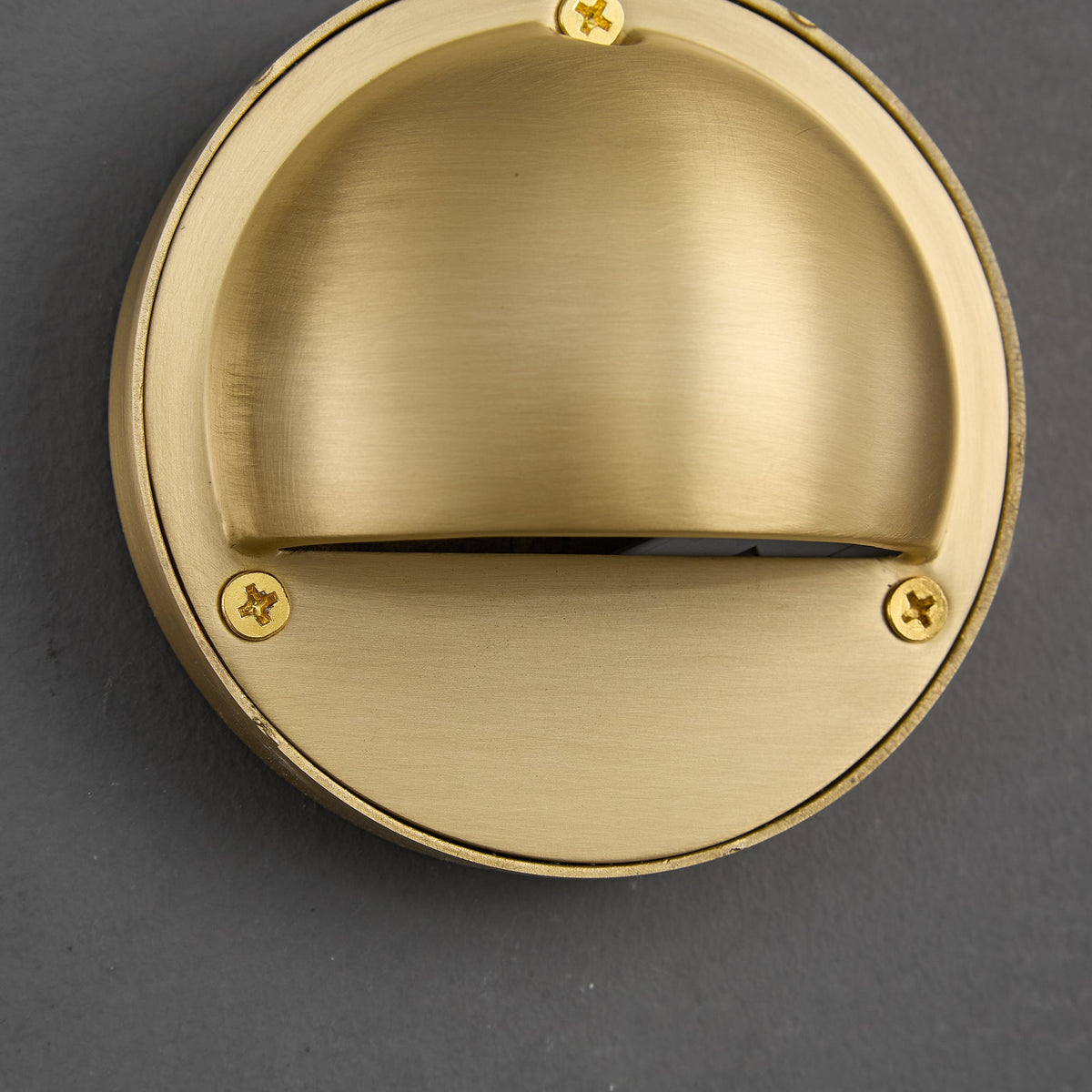 Round Brass Wall Sconce with Shielded Glow
