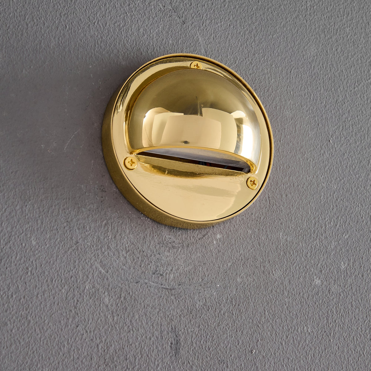 Round Brass Wall Sconce with Shielded Glow