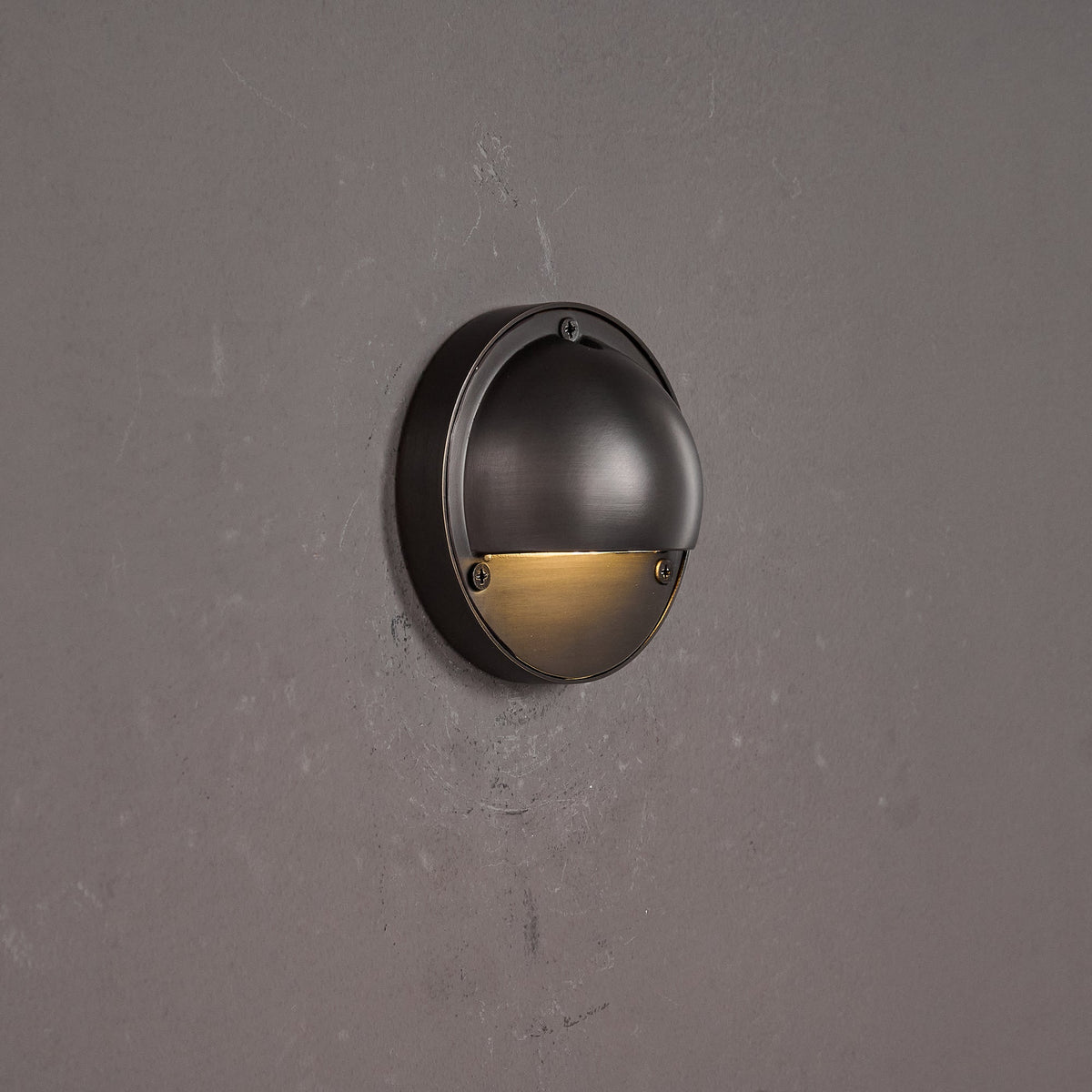 Round Brass Wall Sconce with Shielded Glow