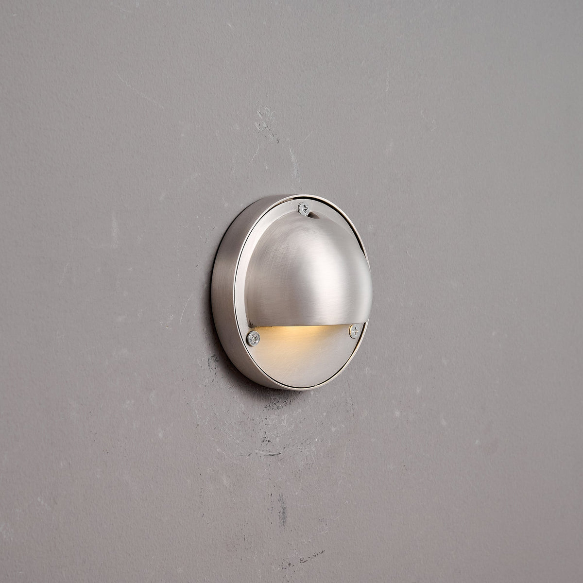 Round Brass Wall Sconce with Shielded Glow