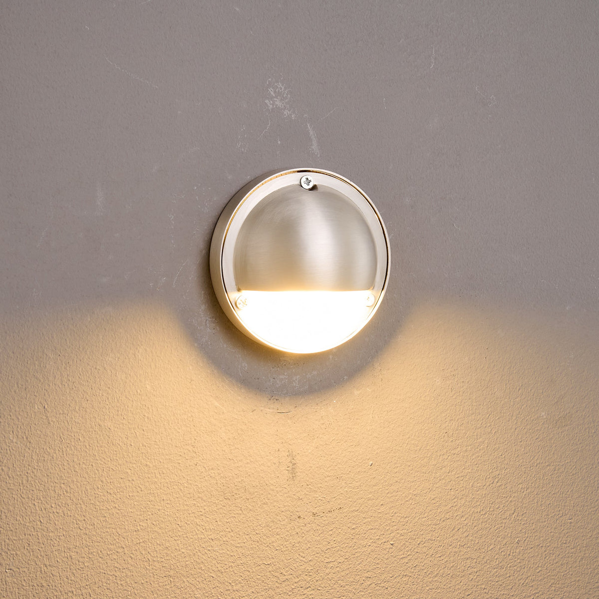 Round Brass Wall Sconce with Shielded Glow