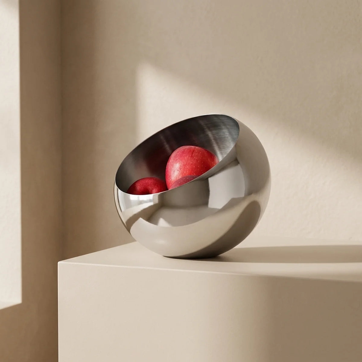 Polished Stainless Steel Fruit Bowl With Modern Open Design - Image 1