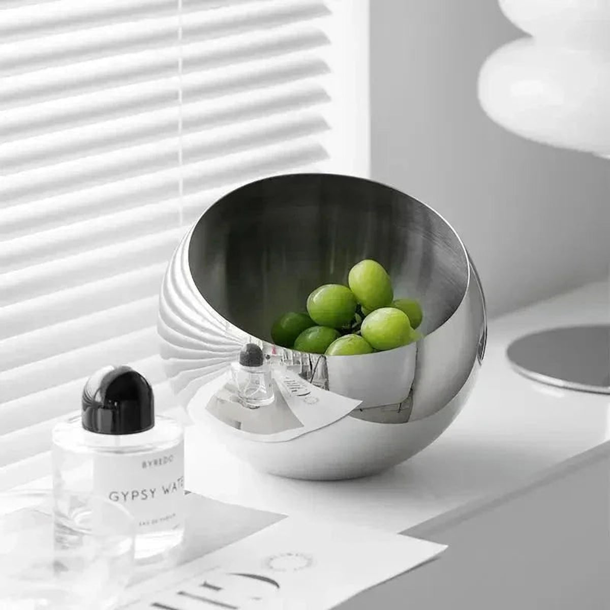 Polished Stainless Steel Fruit Bowl With Modern Open Design - Image 4